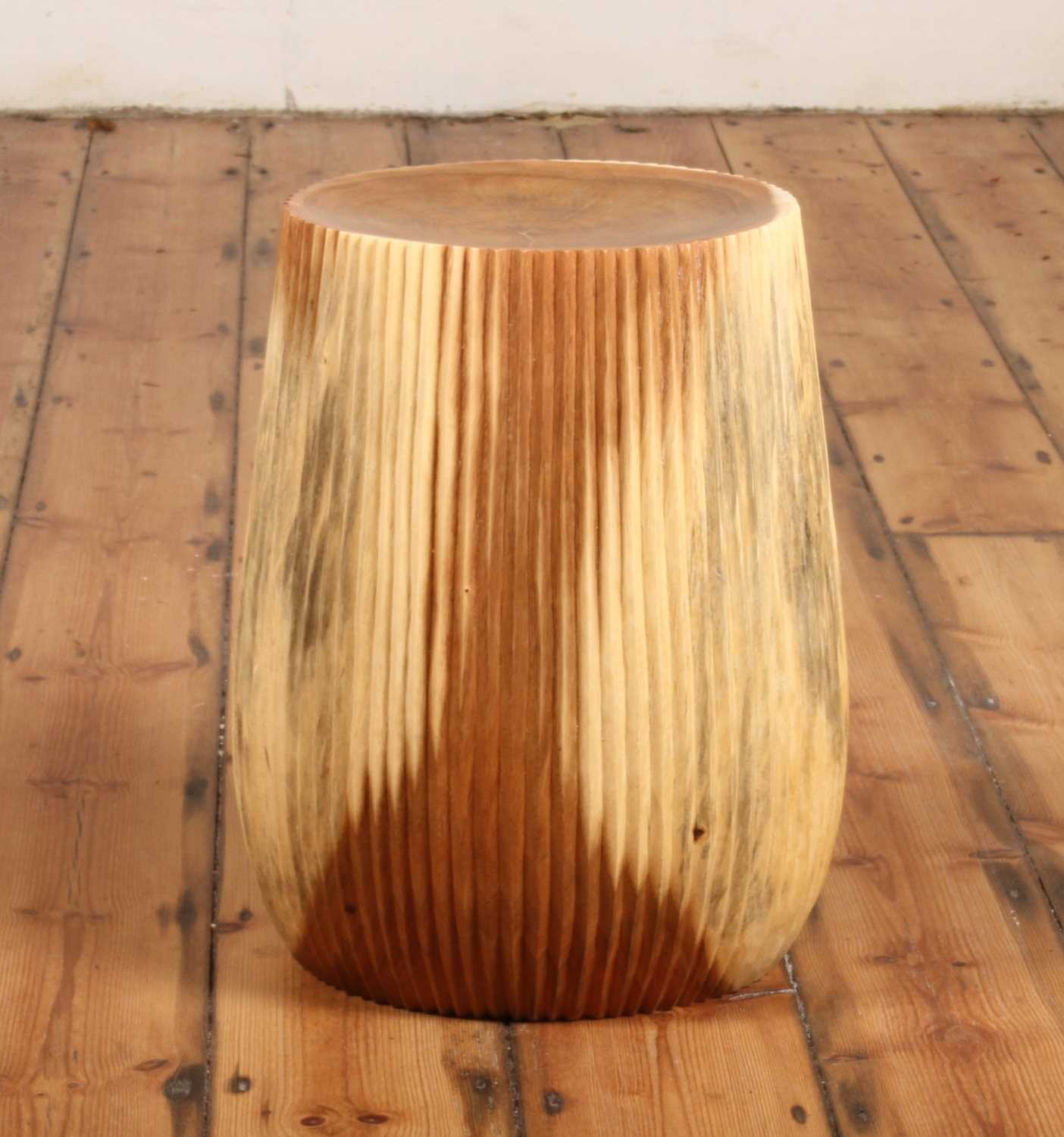 Alur Stool photographed on wooden floor in natural light
