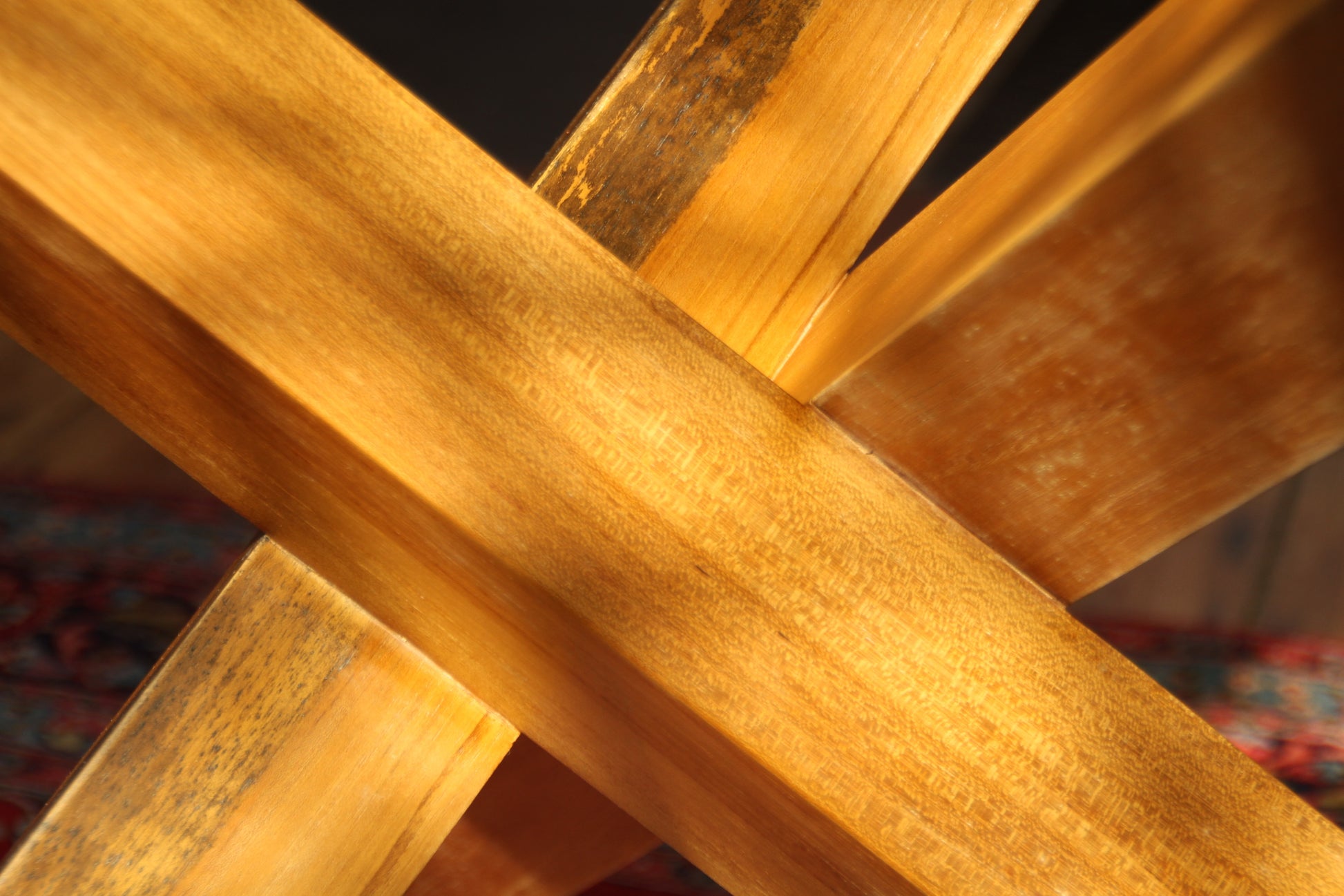 Close-up of teak joinery detail and wood grain under light