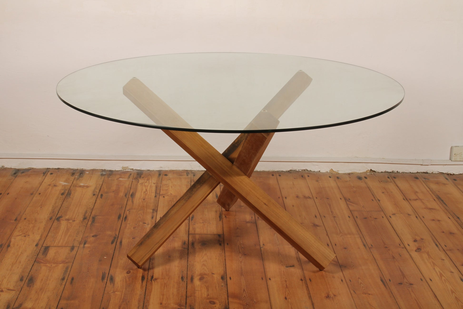 Simpang Round Table full view with intersecting solid teak base and round glass top