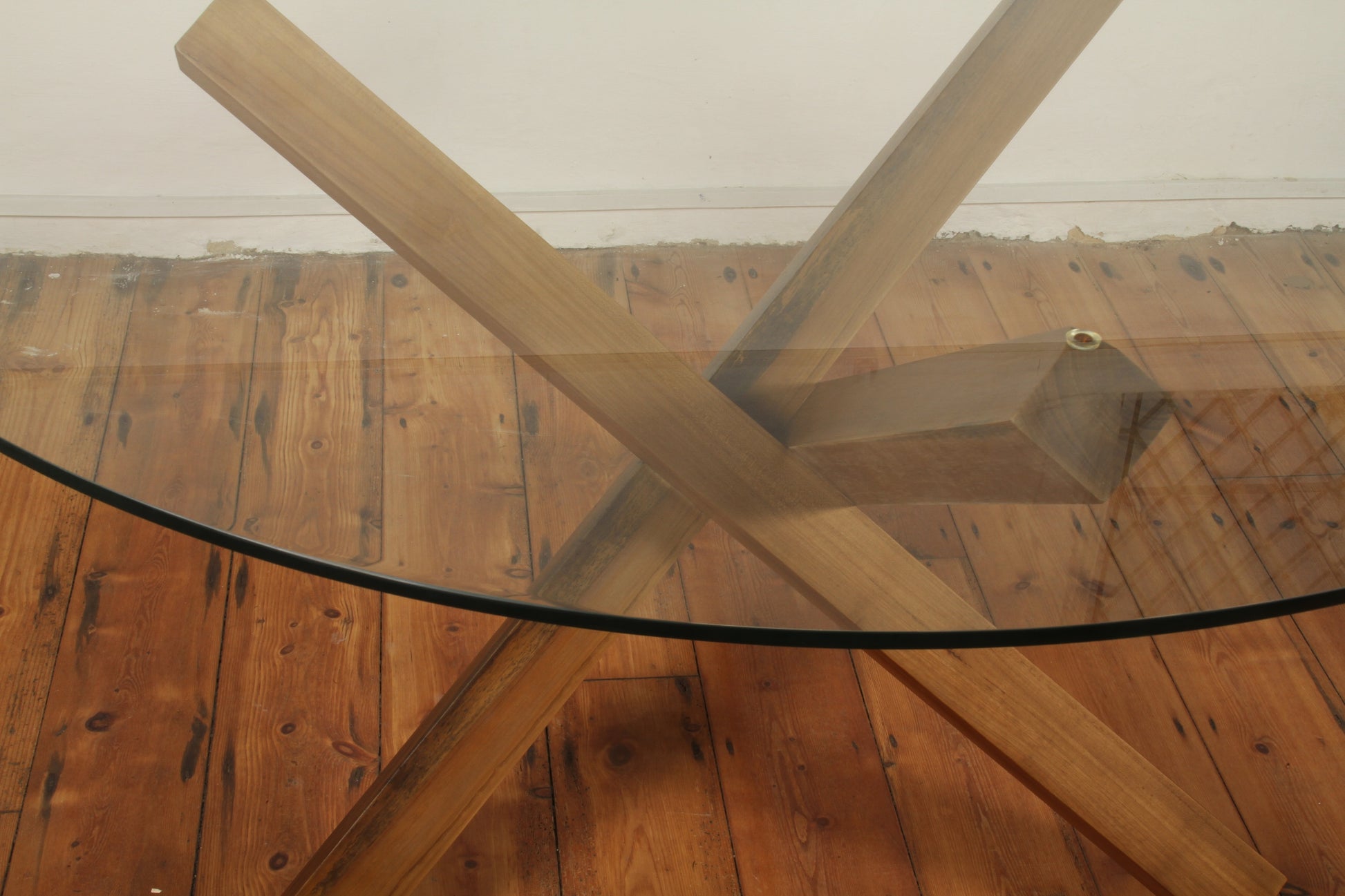 Top-down view of Simpang Table showing clear glass and visible timber intersection