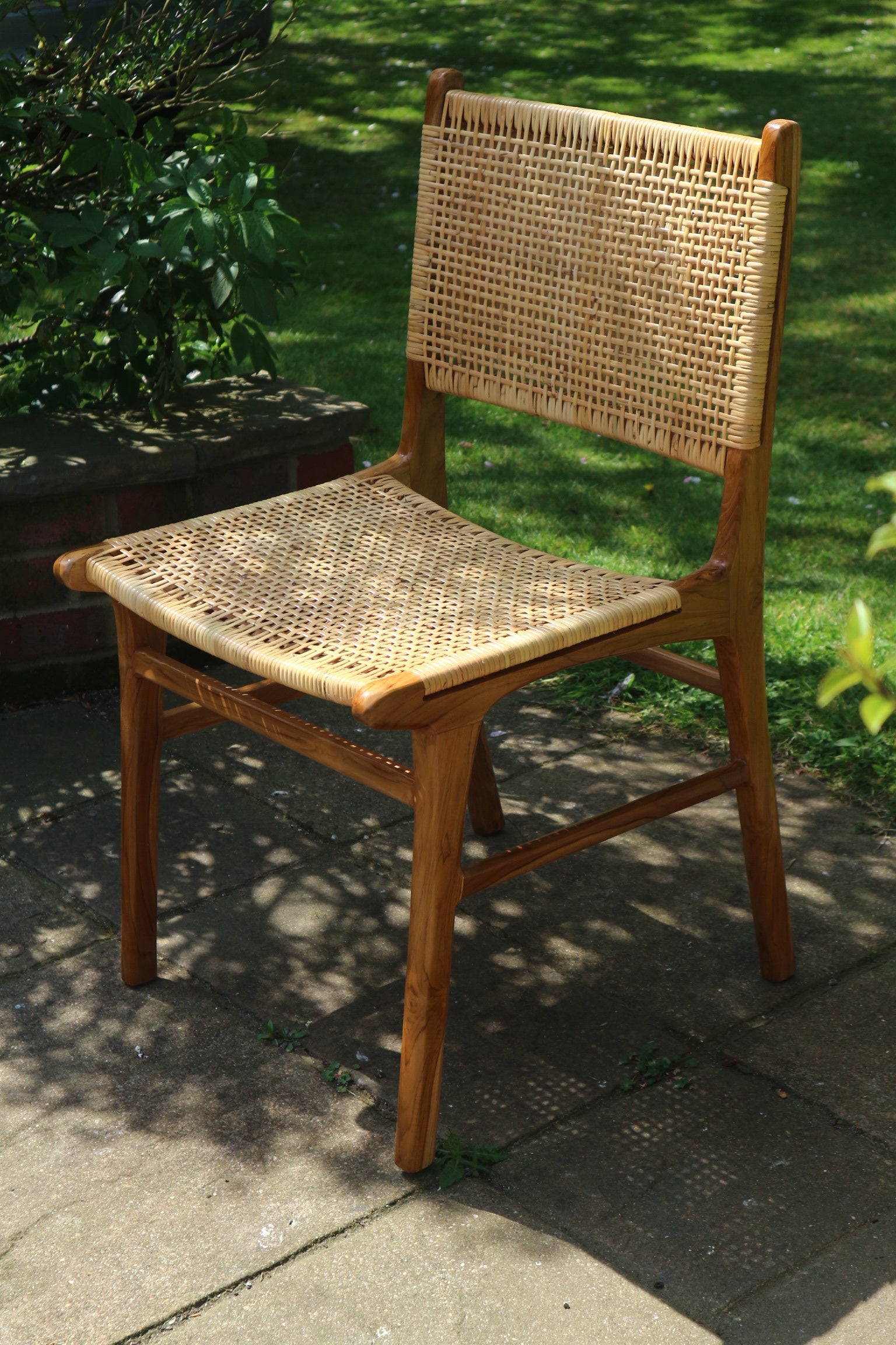 Sora Chair in outdoor setting with natural sunlight and shadow