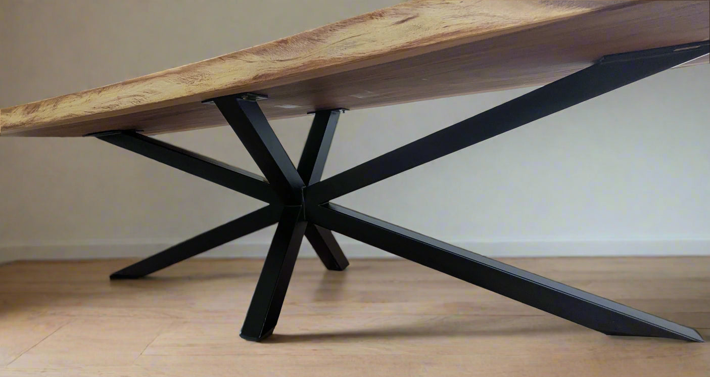 Close-up of aged teak grain on Tua Table’s surface
