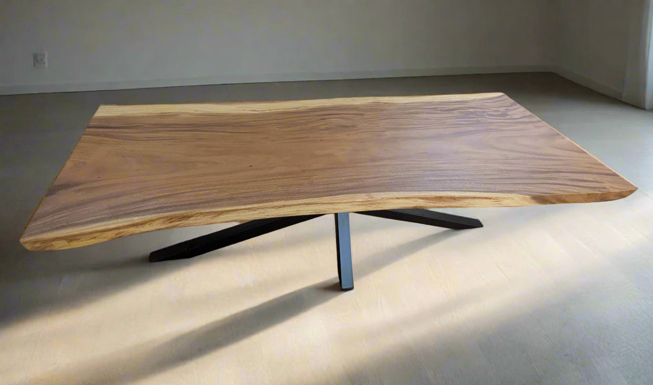 Tua Table front view showing live-edge teak slab and black metal base