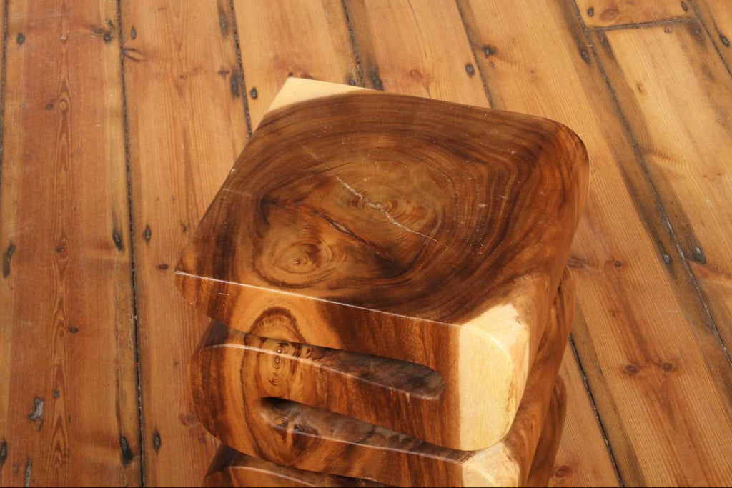Top view of the Arus Stool highlighting its polished wood grain and natural lines