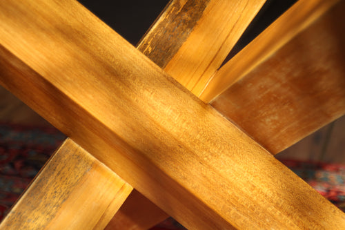 Close-up of teak joinery detail and wood grain under light